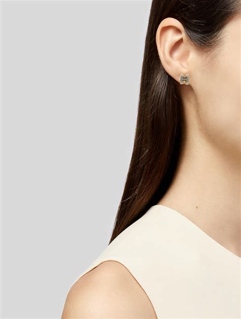 hermes h earrings white|Hermes horn and lacquer earrings.